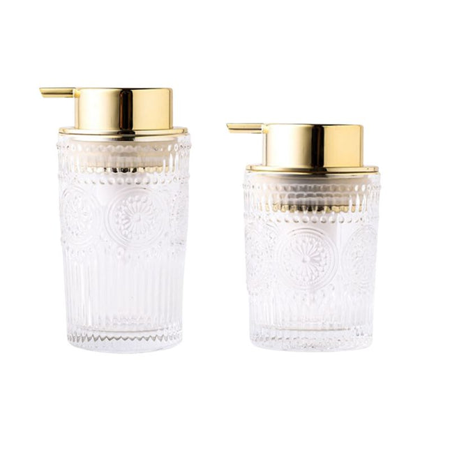 Dispenser sapone in vetro dosatore dorato.