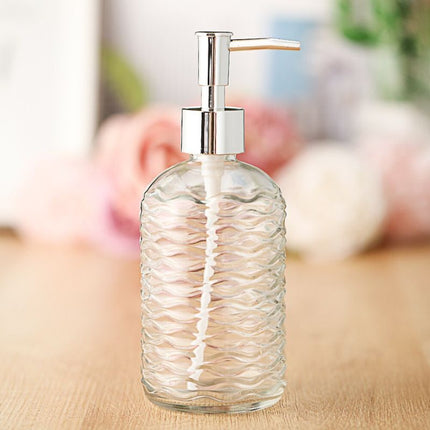 Dispenser sapone in vetro design ondulato.